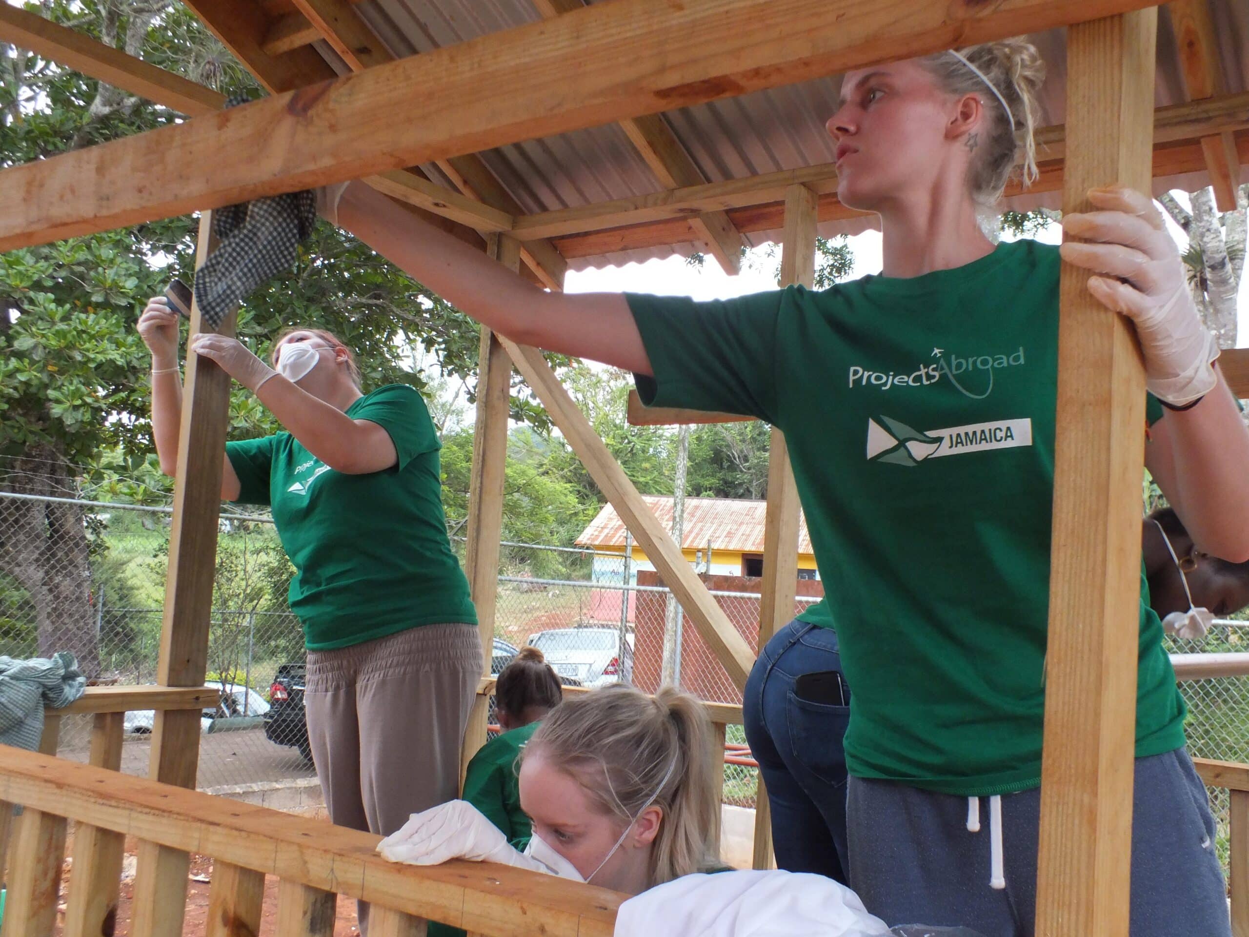 A team from Projects Abroad take part in construction volunteering in Jamaica to build playhouse for local school